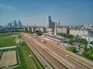 Fototapeta na wymiar Racing track in non racing day without horses and main building at Moscow hippodrome on summer day - aerial view
