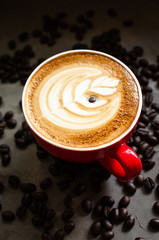 hot latte art in red mug