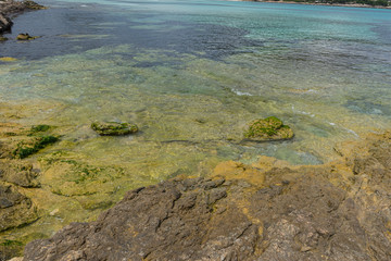 Travel, the calm sea, blue water texture with turquoise tones of the mediterranean sea on the island of Mallorca, Spain