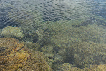 Vacation, the calm sea, blue water texture with turquoise tones of the mediterranean sea on the island of Mallorca, Spain