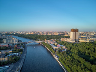 View on the Andreevsky convent and Russian science on the sunset, summer cityscape. Aerial drone view