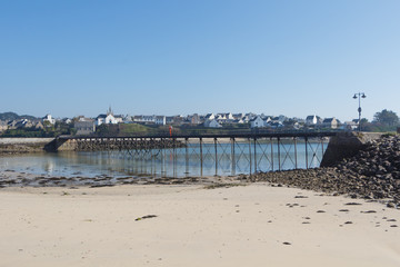 Bridge and beach at low tide in Audierne