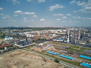 Fototapeta na wymiar Moscow oil refinery in Kapotnya district, Russia. Industrial pipes and tanks of oil refinery factory. Aerial drone view