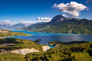 France, Hautes-Alpes (05), Baie-Saint-Michel. Serre-Poncon Lake and Grand Morgon peak in Summer....