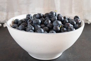 Fresh picked blueberries in a light and bright kitchen environment.