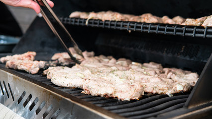 grilling meat outdoor close-up. Summer chill lifestyle with grilling meat.