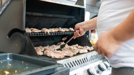 grilling meat outdoor close-up. Summer chill lifestyle with grilling meat.