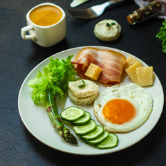 breakfast, healthy food (scrambled eggs, bacon, lettuce, asparagus, cucumbers, cheese). food background. copy space
