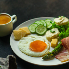 breakfast, healthy food (scrambled eggs, bacon, lettuce, asparagus, cucumbers, cheese). food background. copy space