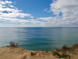 Red high cliffs at Praia da Falesia, a paradise beach in Albufeira in Portugal