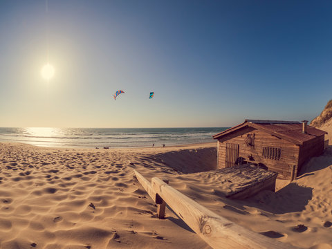France, Contis Plage, kite surfers on sandy beach