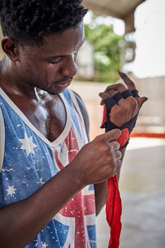 Boxer applying bandages
