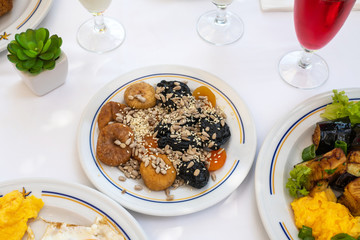 Figs, prunes and sunflower seeds and others on plate - healthy breakfast concept