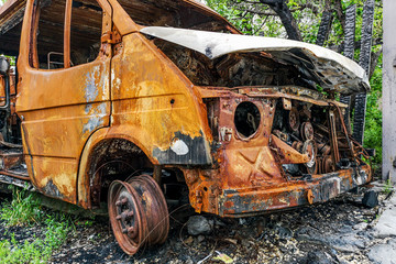 Burned car. Consequences of car accident. Damaged by arson. Machine after a fire