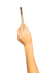 Woman's hand holding makeup brush on white back