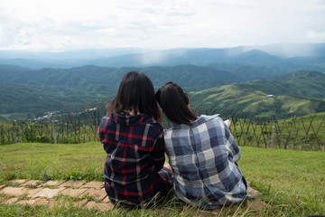 Fototapeta na wymiar Friendship between friends. Two women sitting at the view
