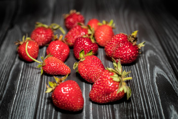 Strawberries on dark boards
