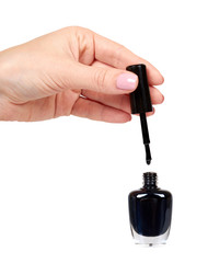 Hand with black nail polish bottle, beauty and care.