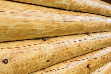 Wooden wall of house from logs.  Natural background and pattern.