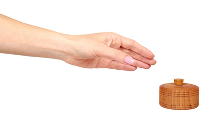 Hand with wooden container, round case. Isolated background