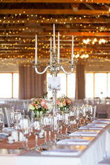 Decorative candles on table at wedding reception