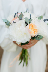 bride holding a beautiful bouquet