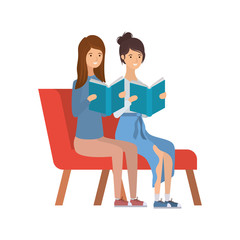 women sitting on chair with book in hands