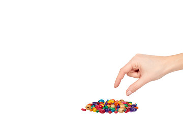 Hand with colored wooden beads, decorative accessory for hand made.