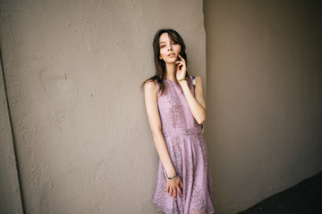 beautiful young girl in dress is resting outdoors, woman is walking on the street