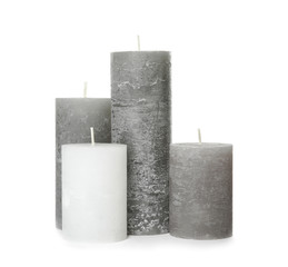 Many color wax candles on white background