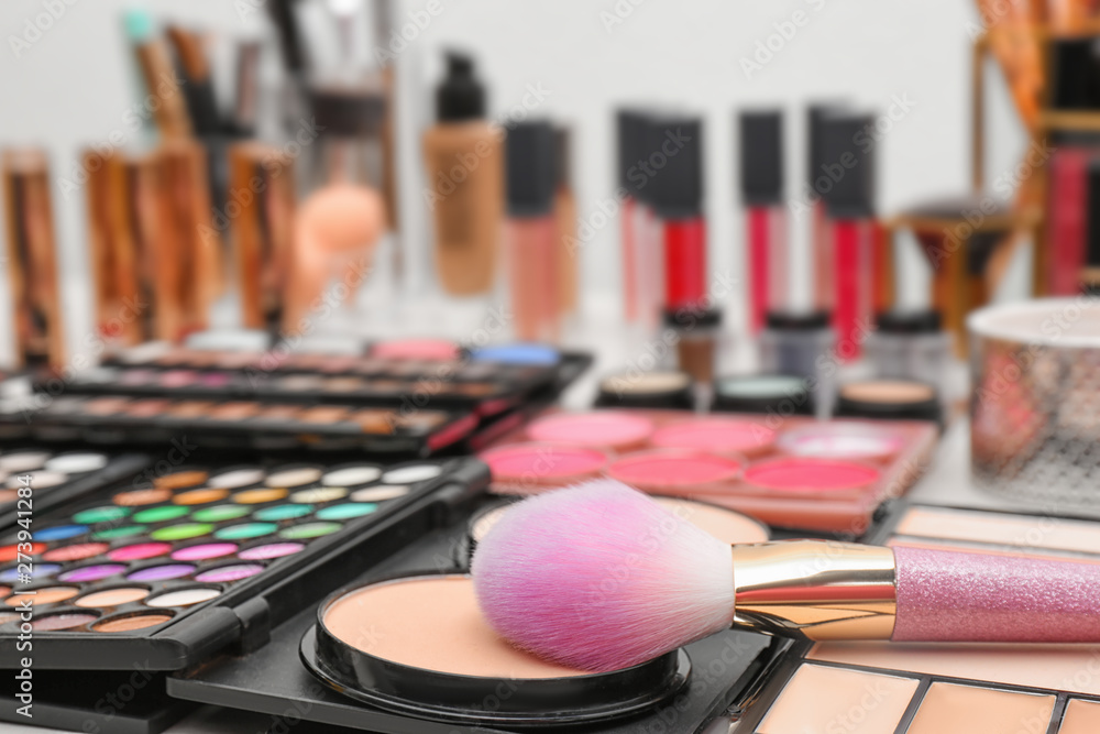 Wall mural set of different professional makeup products on table