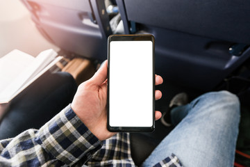 Closeup mockup image of white empty blank smartphone in the male hand