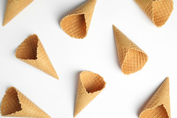 Waffle empty ice cream cones on white background, top view