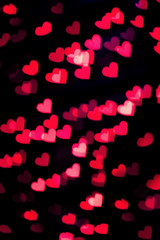 Red and pink heart bokeh background. Christmas and Valentine's day greeting cards, invitations, flyers, perfect for blog posts, banners design.