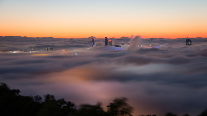 Lights of Brisbane under morning fog