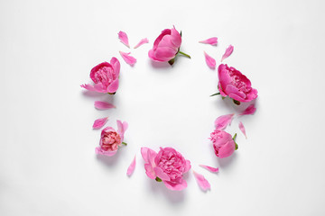 Frame made with fresh peonies on white background, top view. Space for text