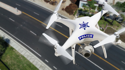 Police Unmanned Aircraft System, (UAS) Drone Flying Above A City Street