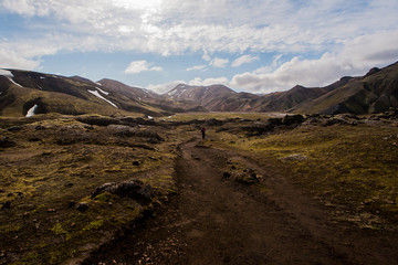 woman hiking in Landmannalaugar in Iceland in summer