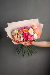 beautiful bouquet of flowers in their hands, delicate pastel shades of plants
