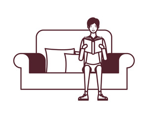 man sitting on chair with book in hands