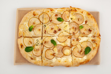 Roman sweet pizza with nuts, pear and honey, baked in coal stove for dessert, isolated on white background