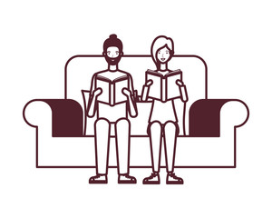 couple sitting on chair with book in hands