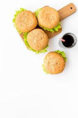 National american food concept with burgers and coke on white background top view mockup
