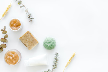 Fototapeta na wymiar Organic cosmetics with herbs and wheat on white background top view mockup