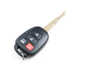 A Toyota car key is isolated on a white background. Close up.