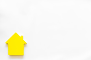 Search for a new house concept with house figure on white office desk background top view space for text