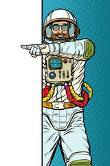 man astronaut. Point to copy space poster