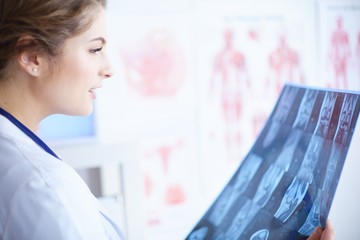 Young female doctor radiologist working in the clinic