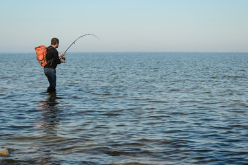 man fishing in the sea