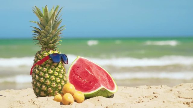 Tropical summer mix fruits with sea background.
